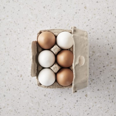 6 wooden eggs in a real egg carton